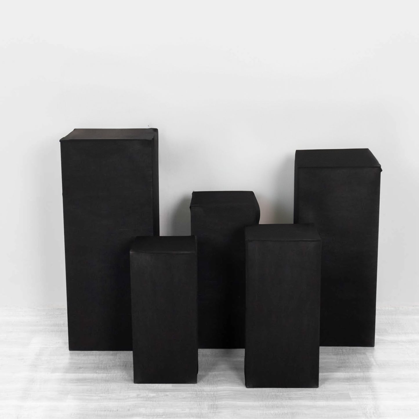Black spandex pedestal stand cover for rectangle pillar props.