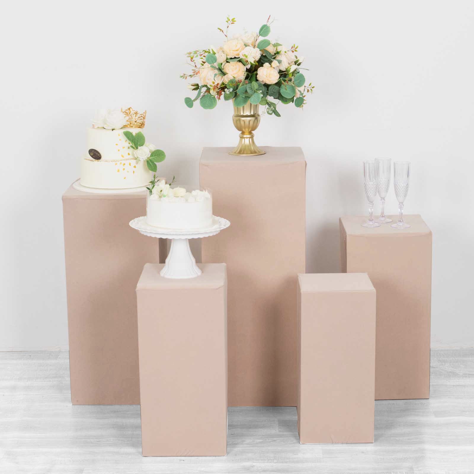 Nude spandex pedestal stand covers for event displays and decorations.