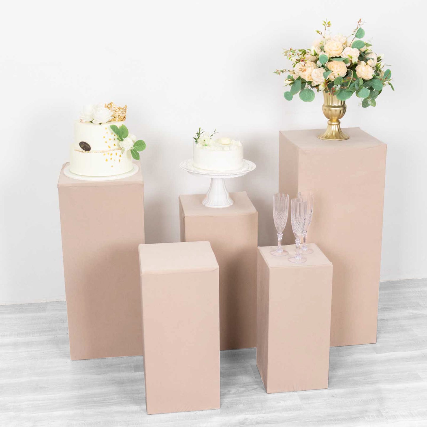 Nude spandex pedestal stand covers in a set of 5 for events and displays.