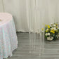 Clear acrylic flower pedestal stand with hanging crystal beads.