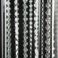 Clear acrylic flower pedestal stand with hanging crystal beads.