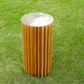 24" gold display column stand with top plate on grass.