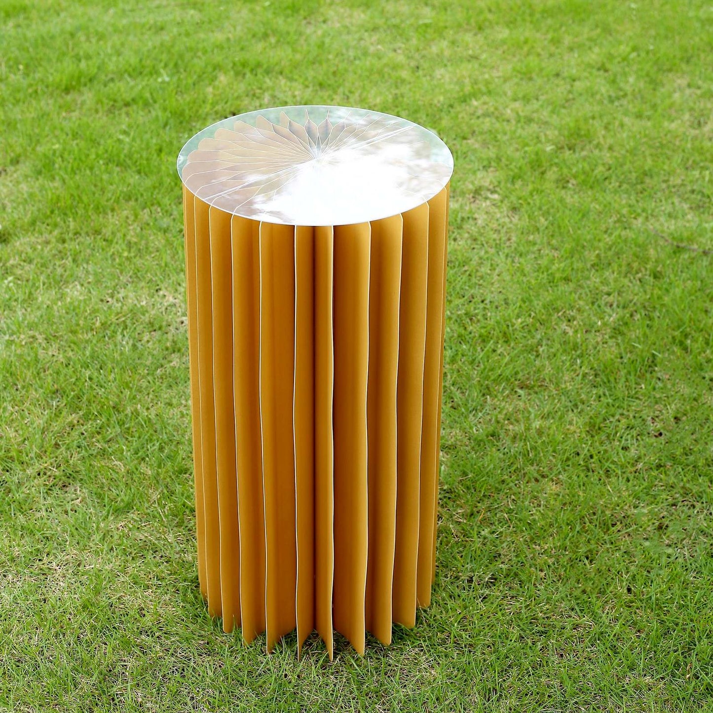24" gold display column stand with top plate on grass.