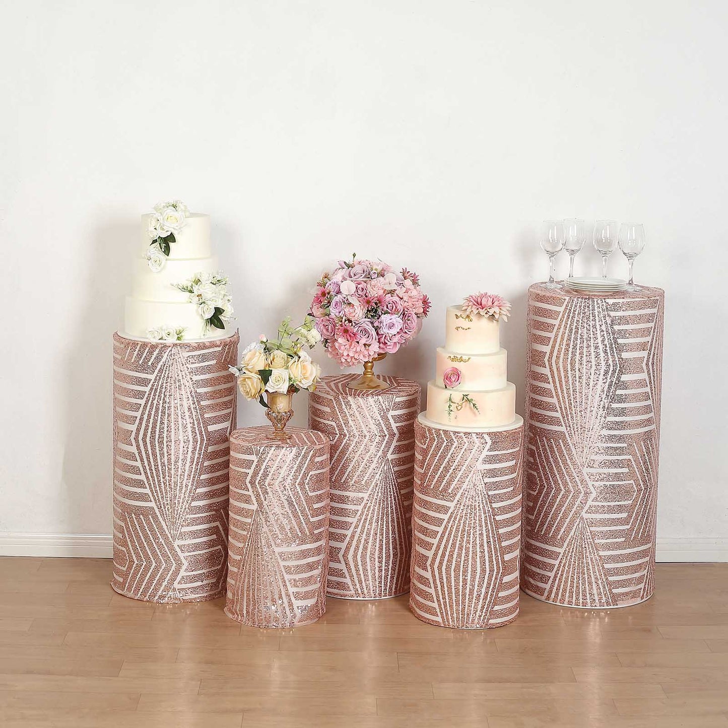 Rose gold sequin mesh pedestal stand covers with geometric embroidery.