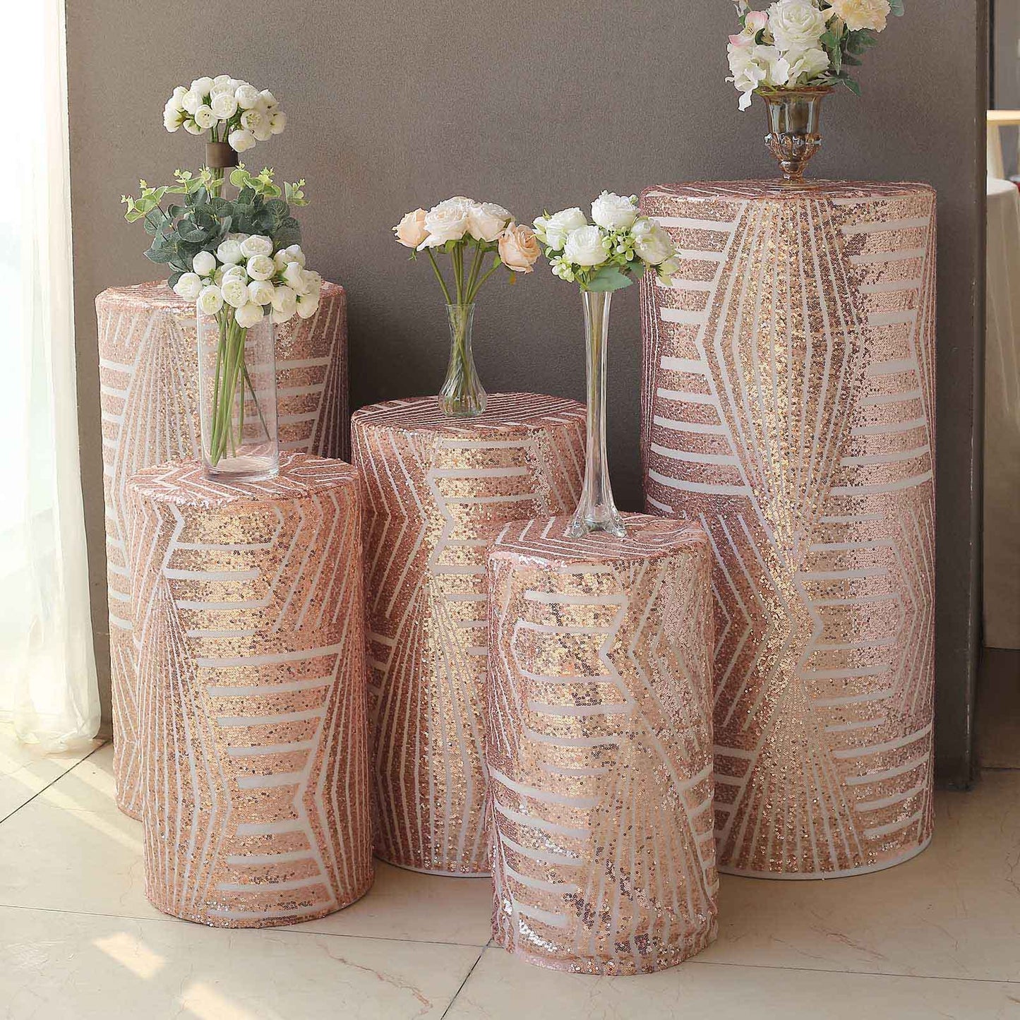 Rose gold sequin mesh pedestal stand covers with geometric embroidery.