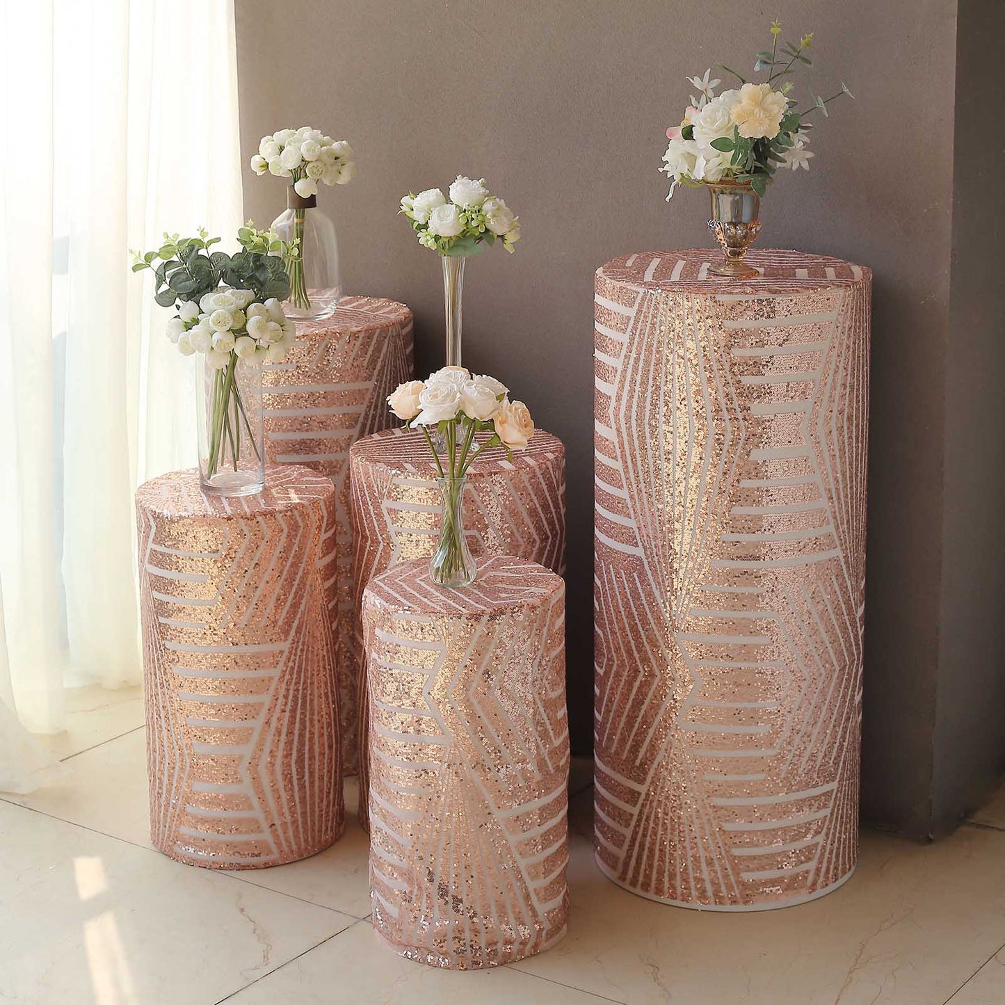 Rose gold sequin pedestal stand covers with geometric embroidery design.