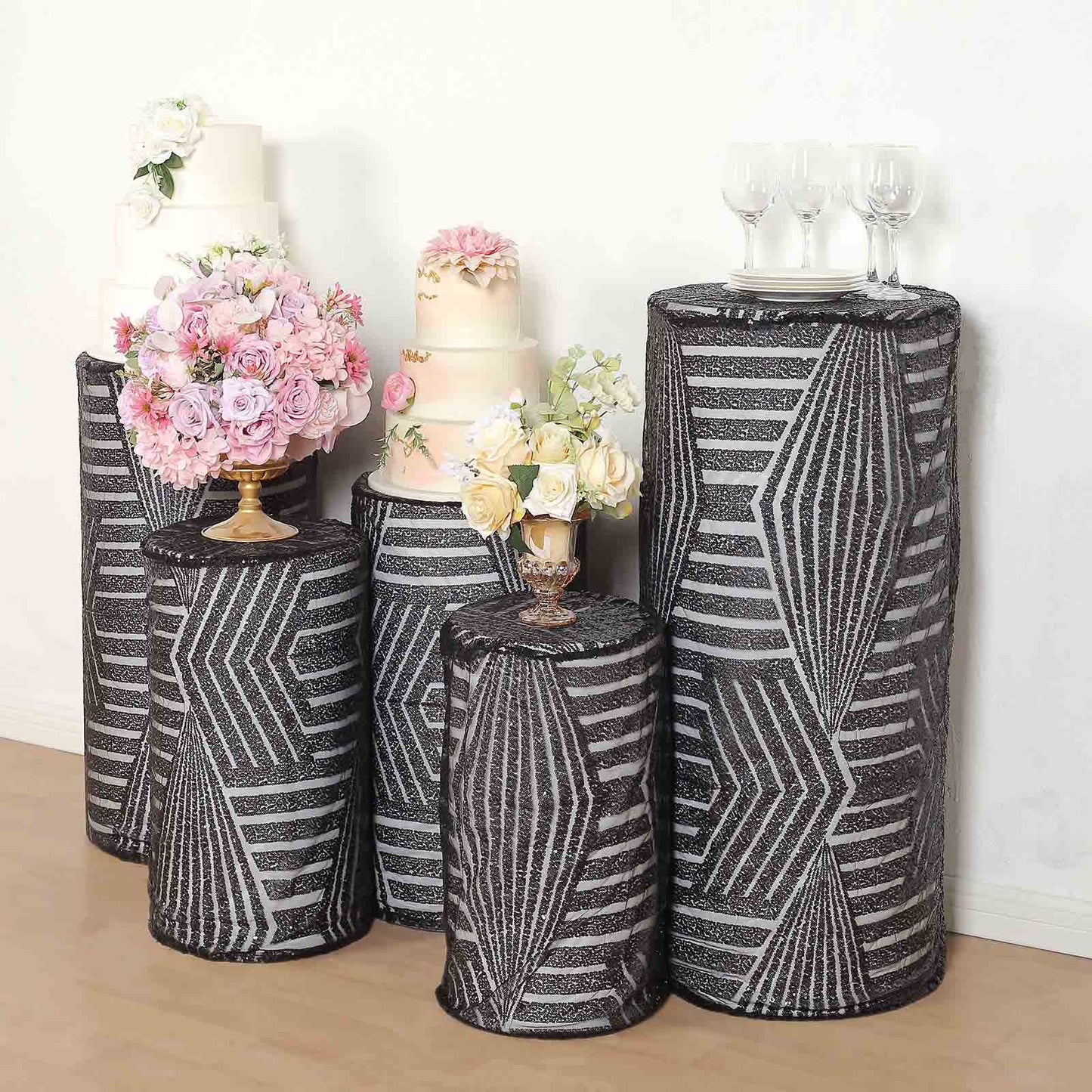 Black sequin mesh pedestal stand covers with geometric pattern.
