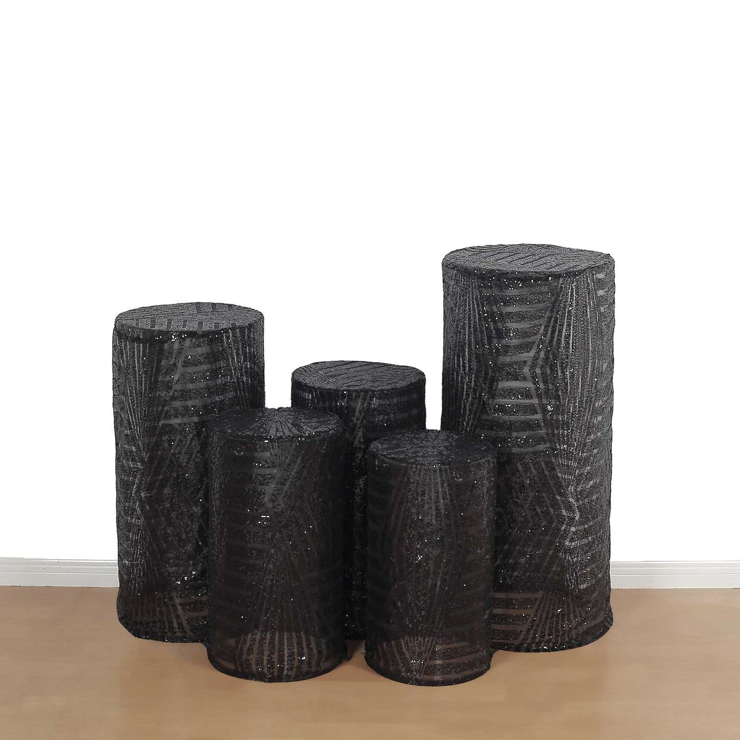 Black sequin mesh cylinder pedestal stand covers with geometric pattern embroidery.