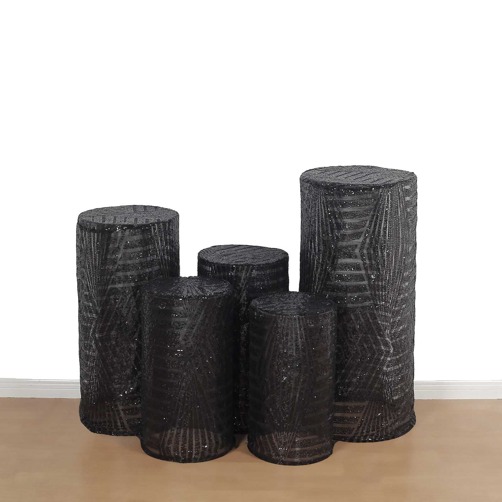 Black sequin mesh cylinder pedestal stand covers with geometric pattern embroidery.