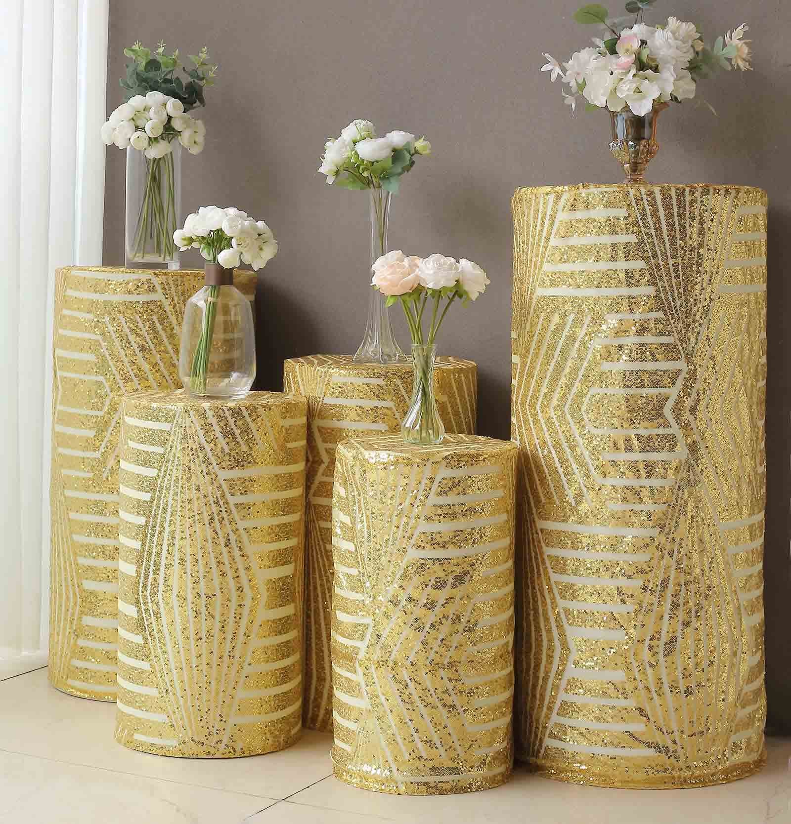 Gold sequin cylinder pedestal stand covers with geometric pattern embroidery.