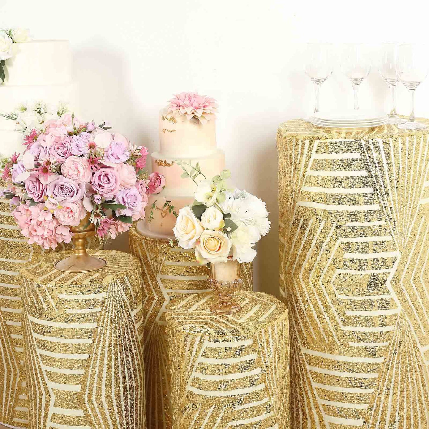 Gold sequin mesh pedestal stand covers with geometric pattern embroidery.