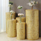 Gold sequin mesh pedestal stand covers with geometric pattern.