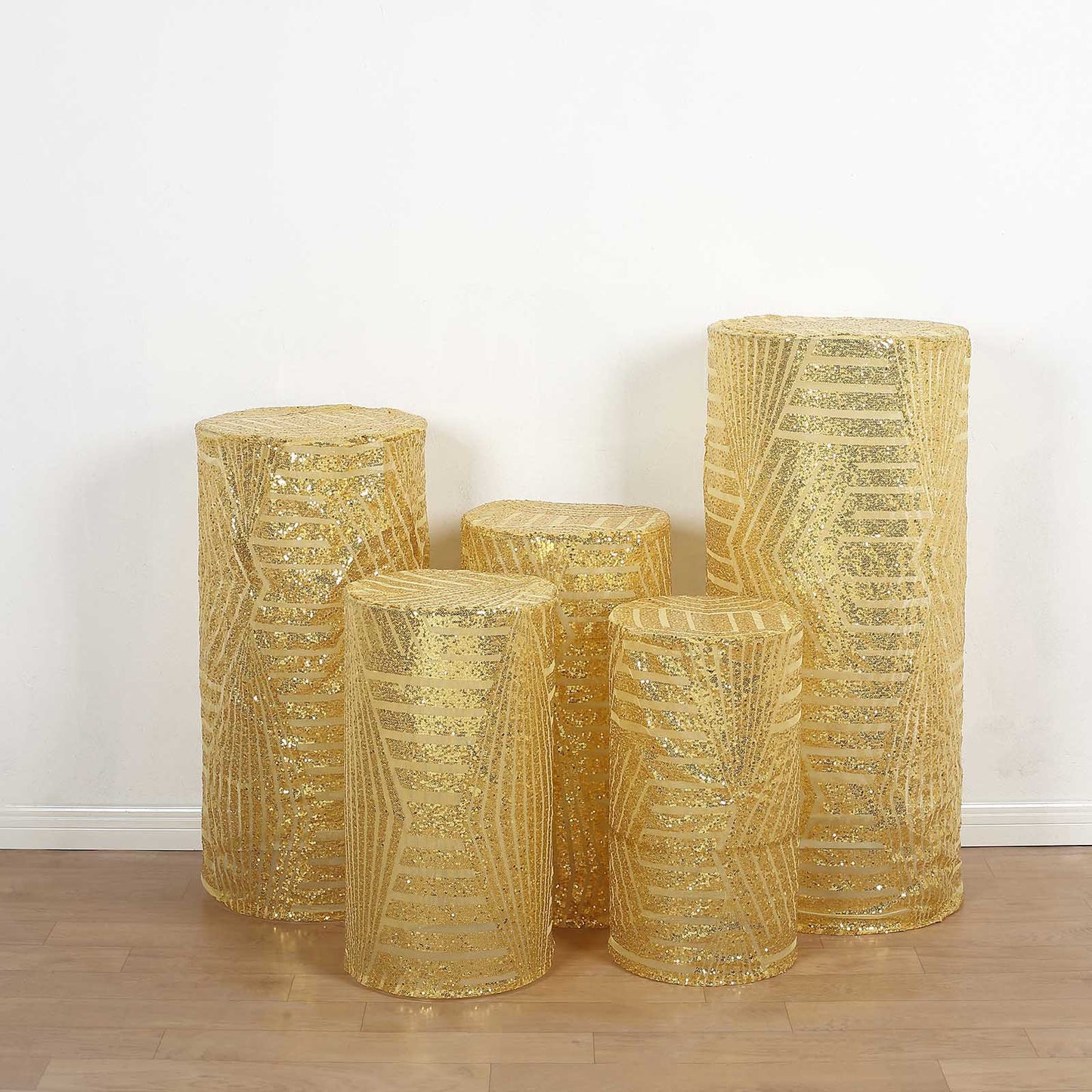 Gold sequin mesh pedestal stand covers with geometric pattern.
