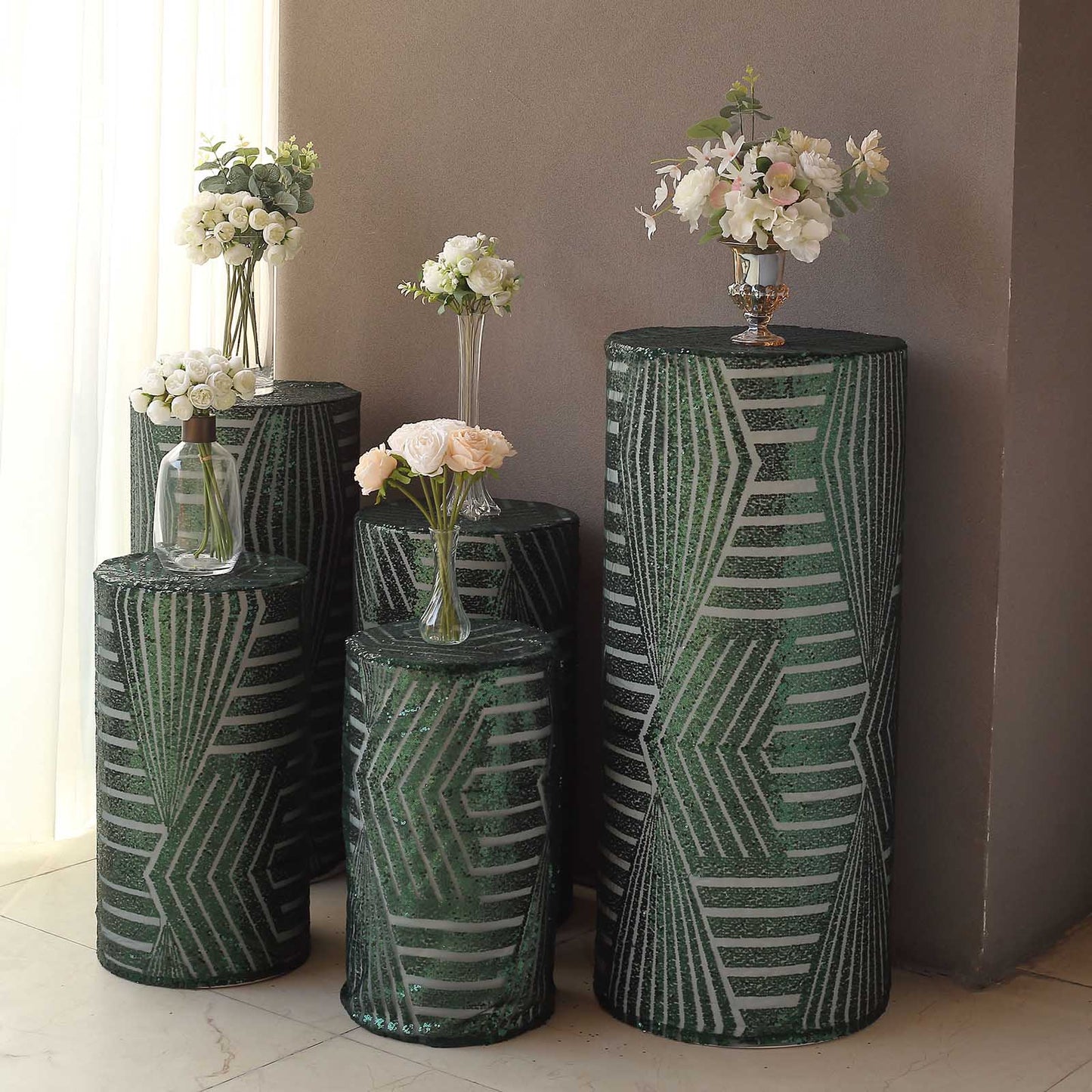 Emerald green sequin mesh pedestal stand covers with geometric pattern.