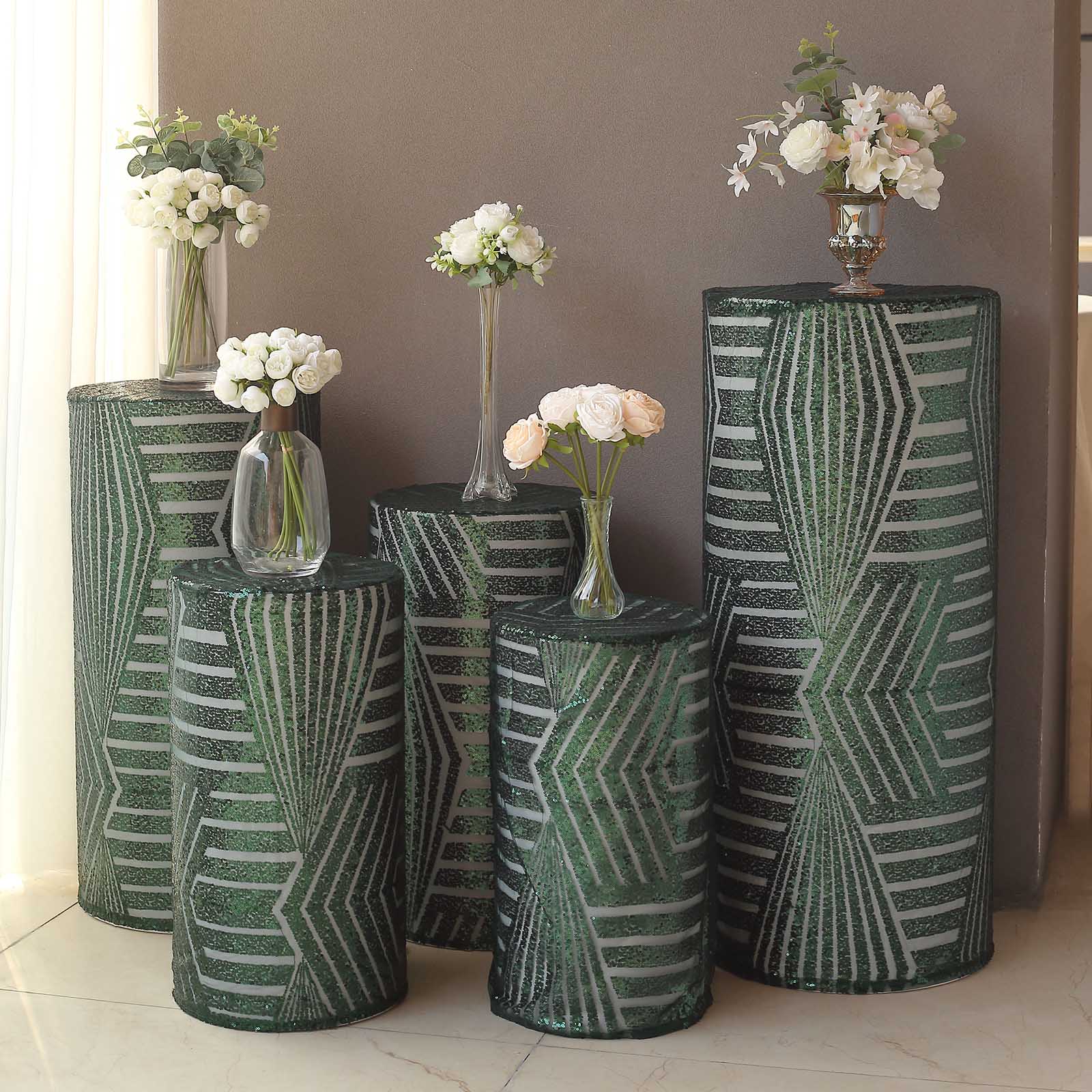 Emerald green sequin mesh pedestal stand covers with geometric embroidery.