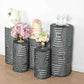 Emerald green sequin mesh cylinder pedestal stand covers with geometric patterns.