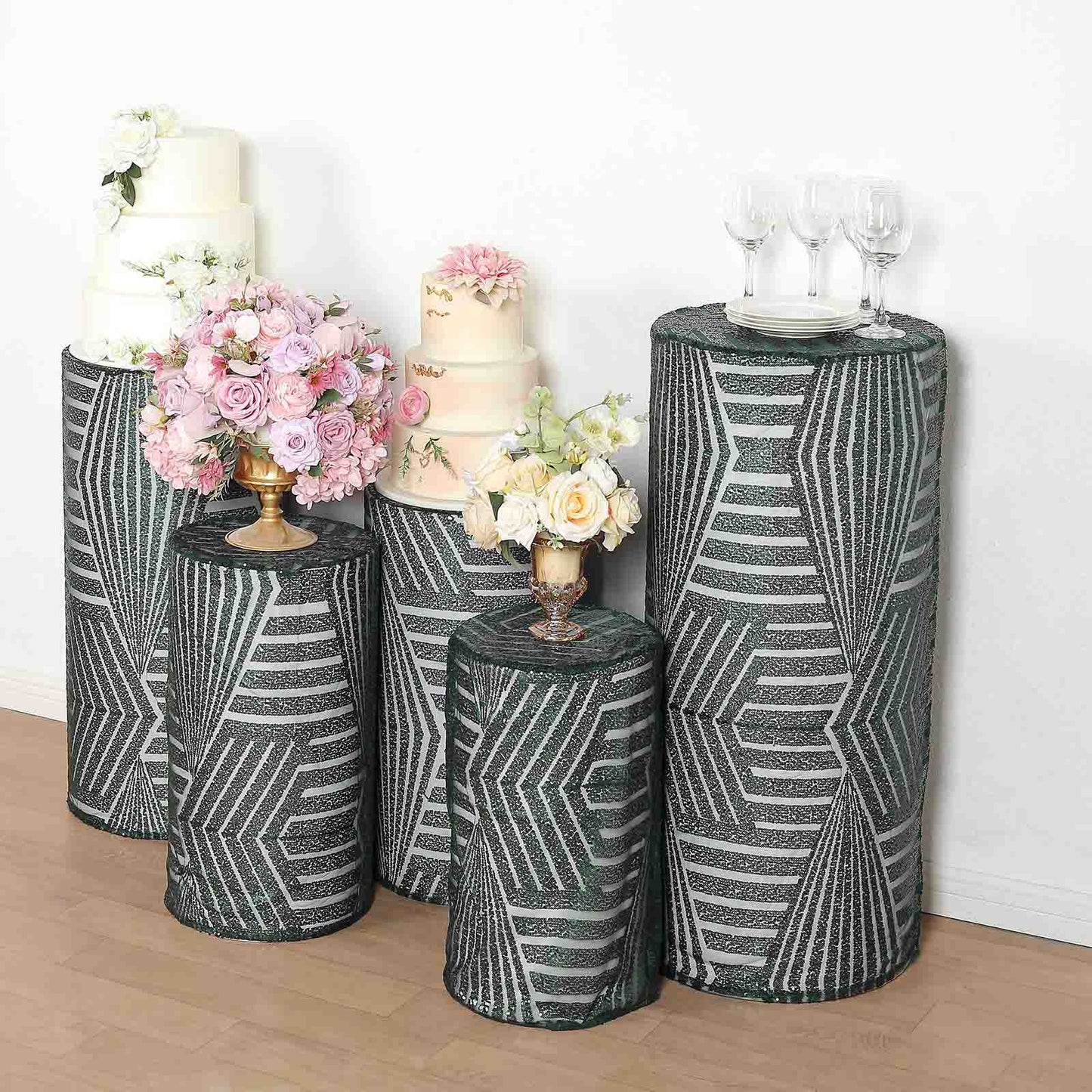 Emerald green sequin mesh cylinder pedestal stand covers with geometric patterns.
