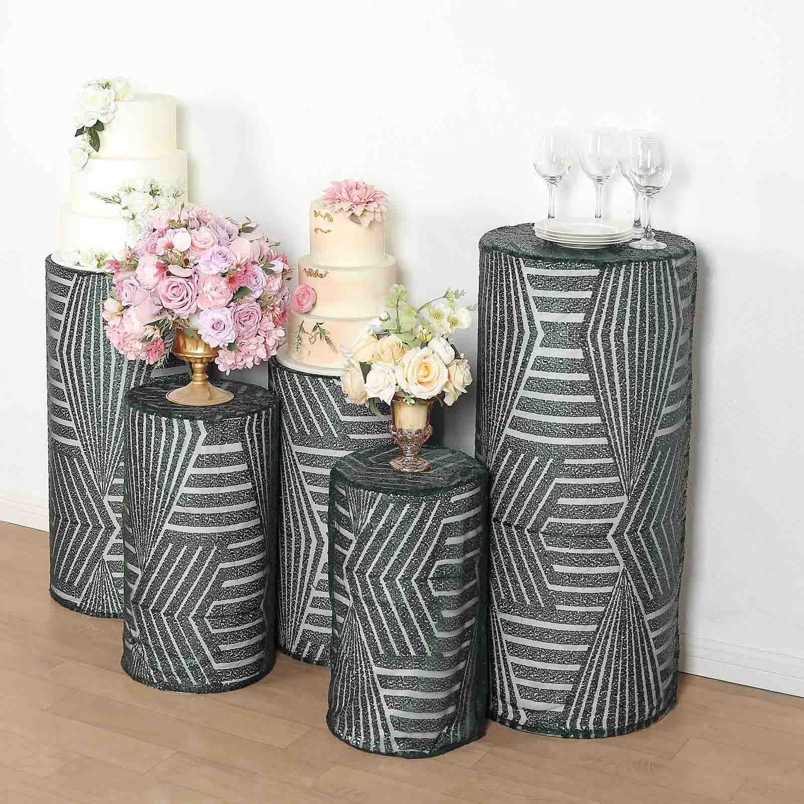 Emerald green sequin mesh cylinder pedestal stand covers with geometric patterns.