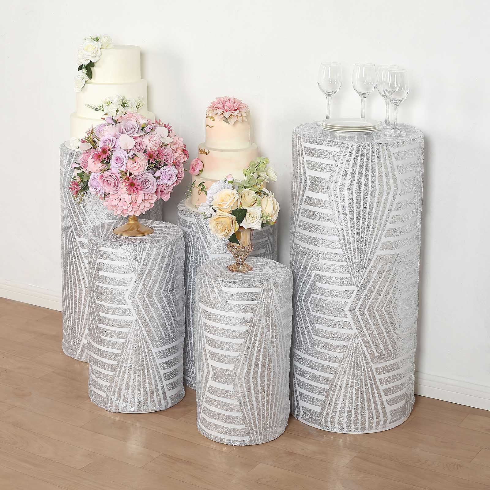 Silver sequin mesh pedestal stand covers with geometric pattern embroidery.