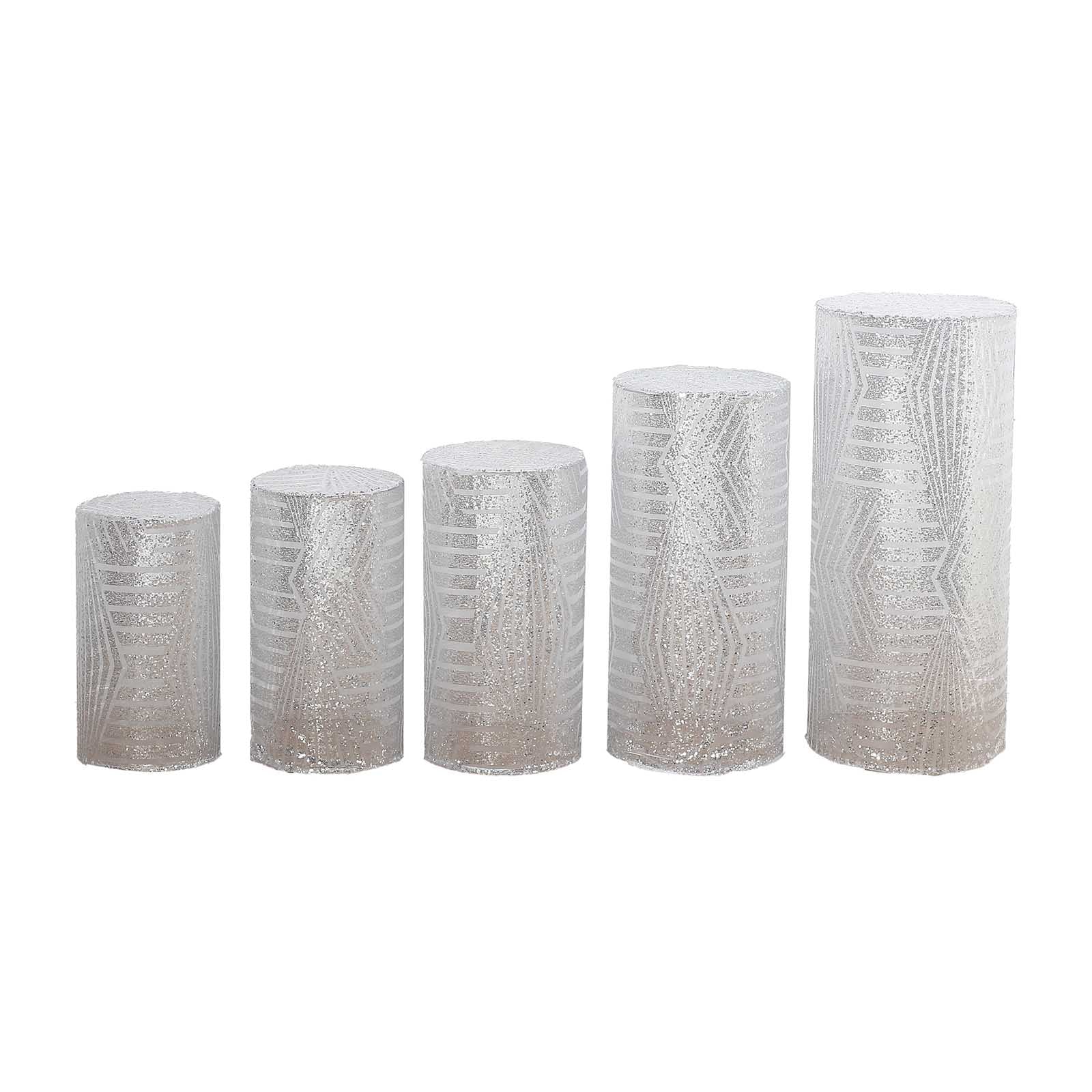 Set of 5 silver sequin mesh cylinder pedestal stand covers with geometric embroidery.