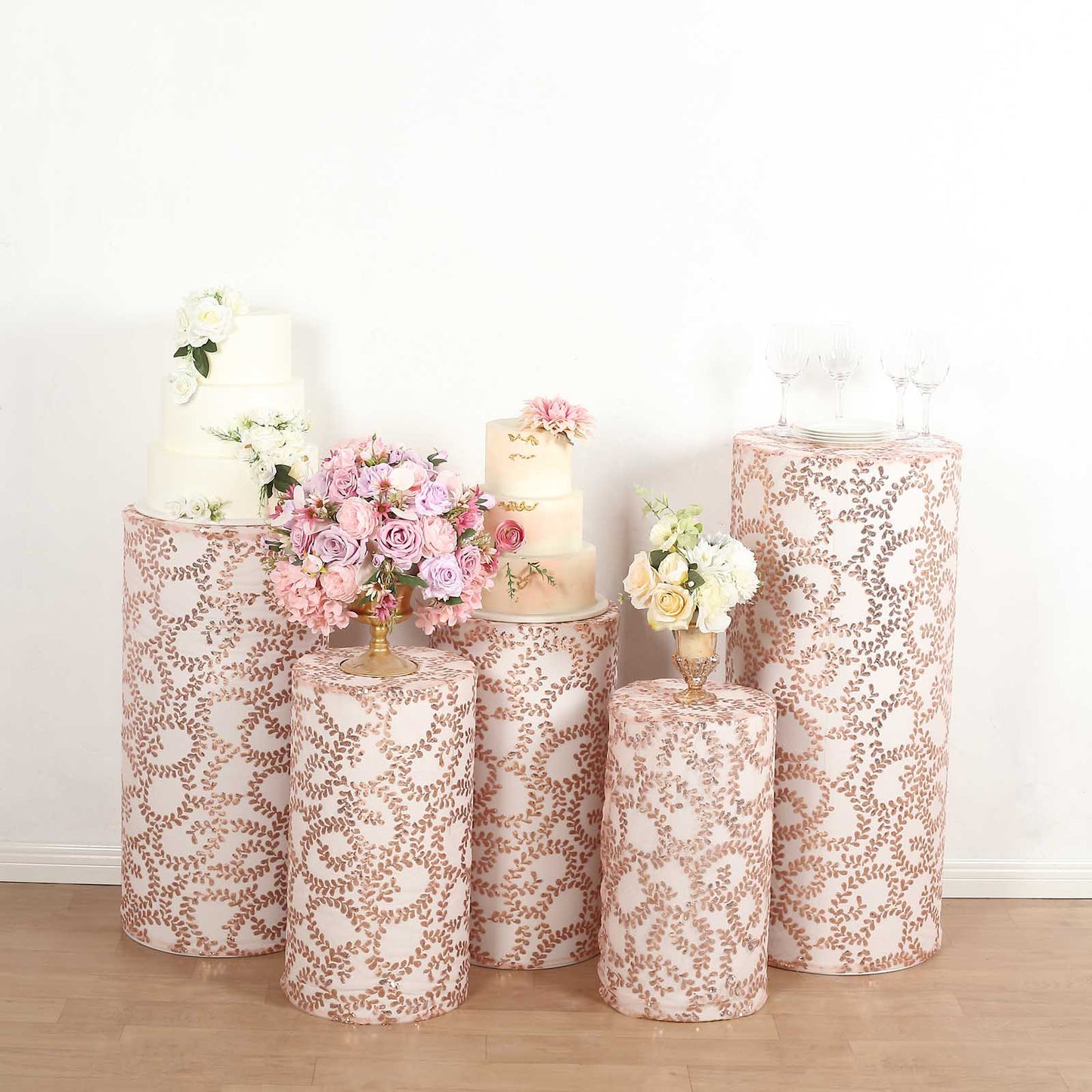 Rose gold sequin mesh pedestal stand covers with leaf vine embroidery.