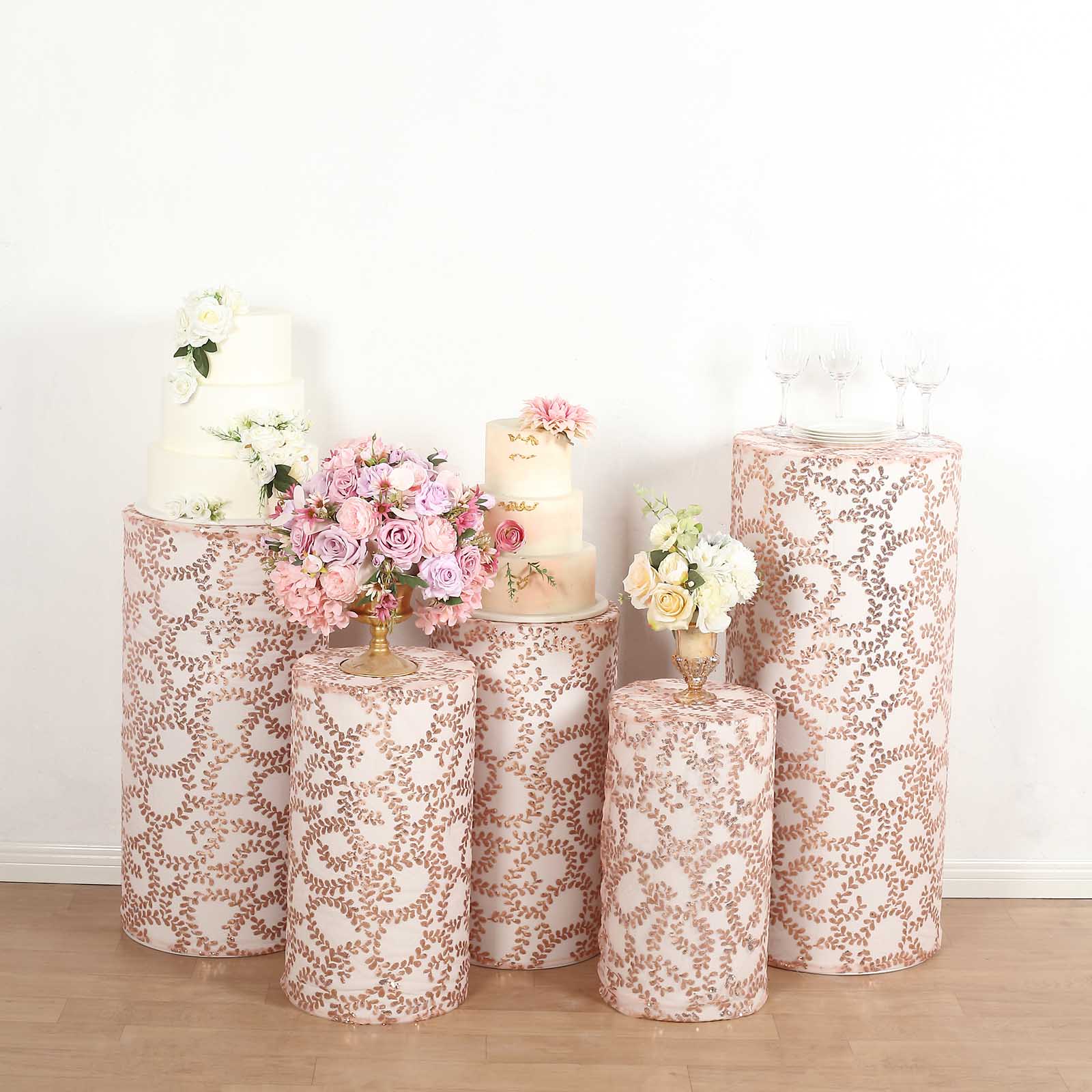 Rose gold sequin mesh pedestal stand covers with leaf vine embroidery.