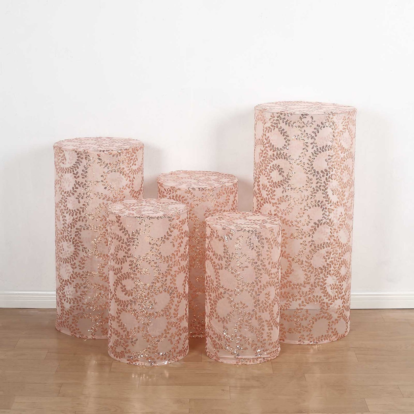Rose gold sequin mesh pedestal stand covers with leaf vine embroidery.
