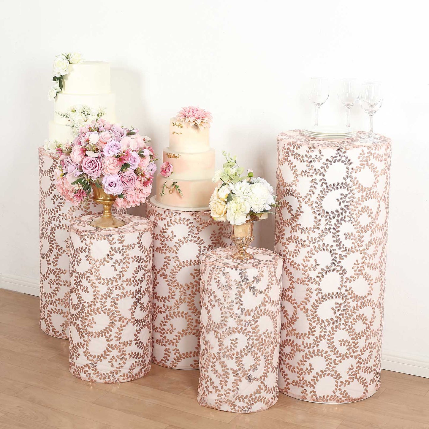 Rose gold sequin mesh pedestal stand covers with leaf vine embroidery.