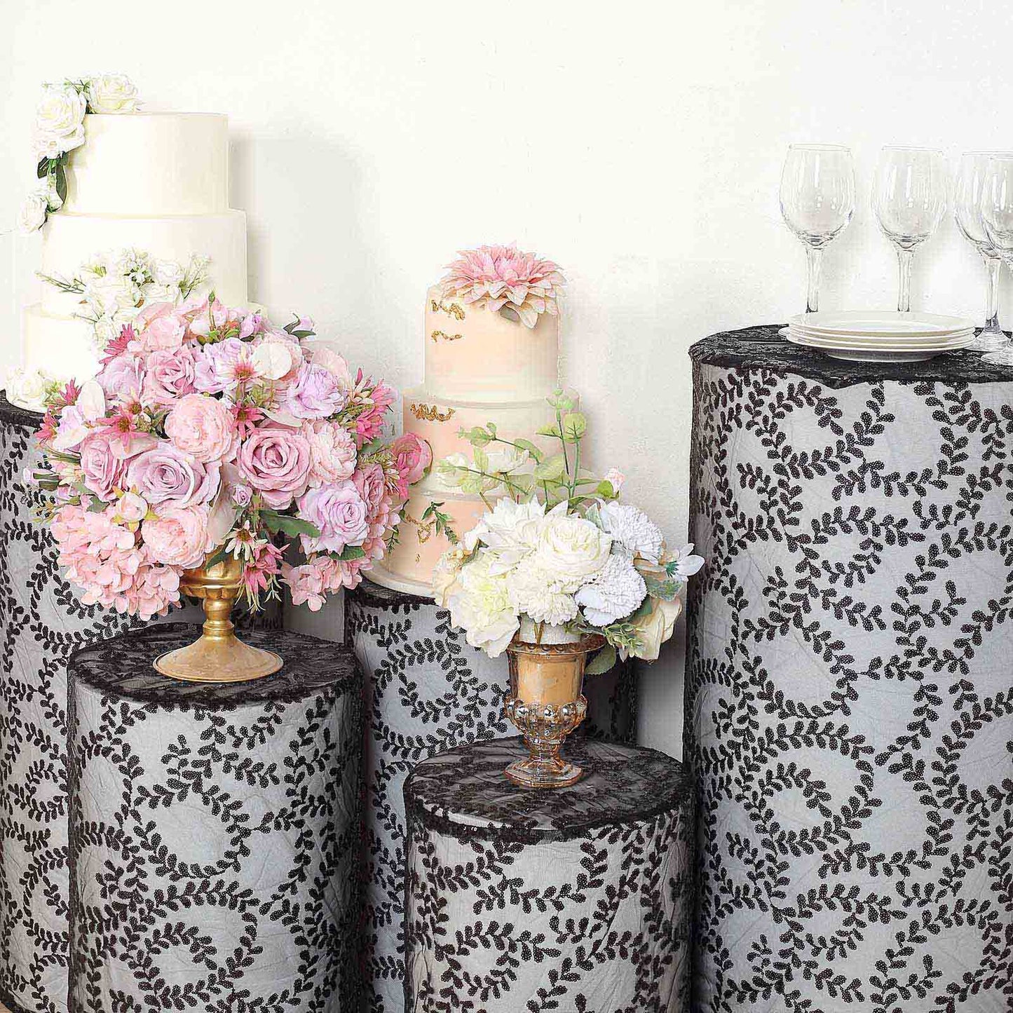 Black sequin mesh pedestal stand covers with leaf vine embroidery.