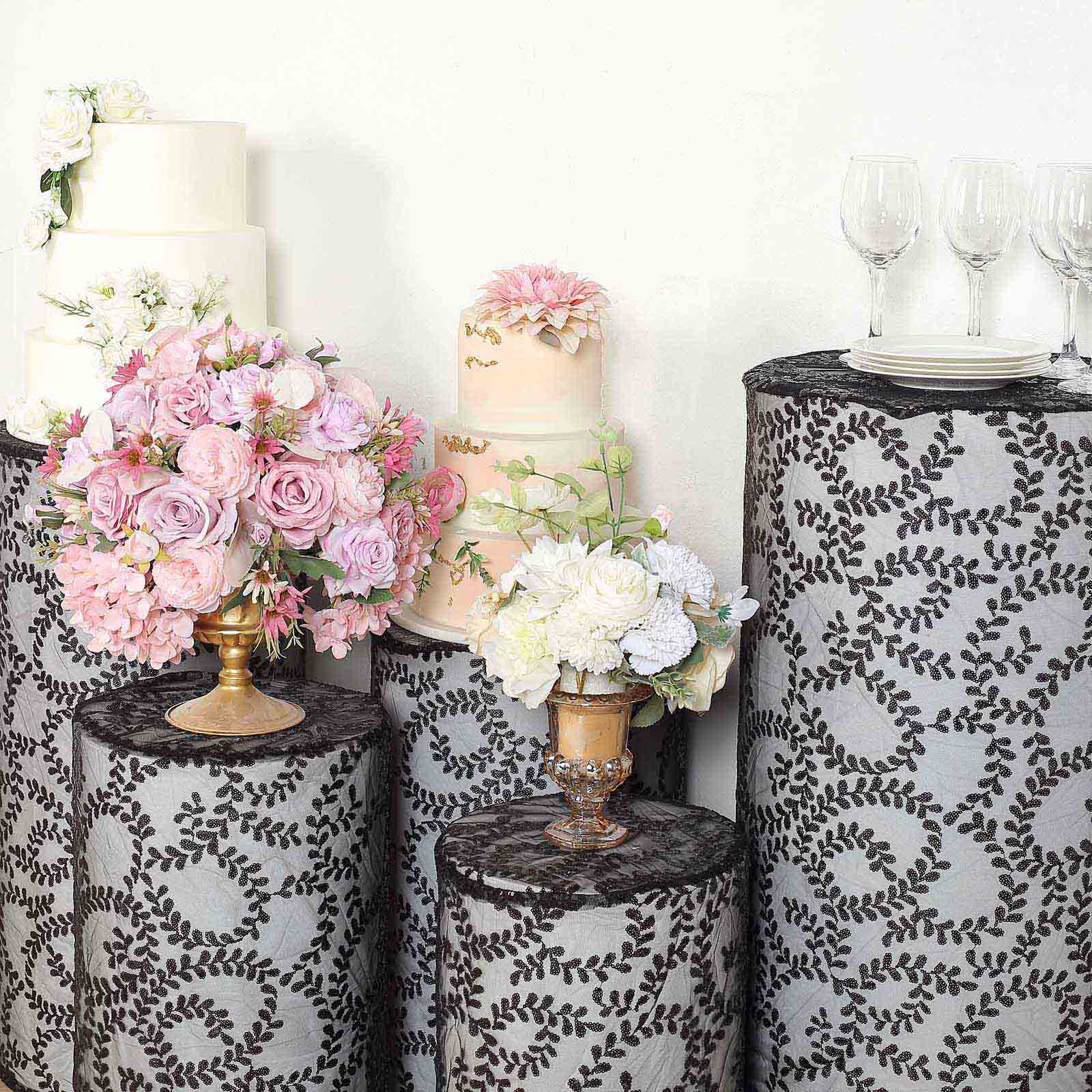 Black sequin mesh pedestal stand covers with leaf vine embroidery.