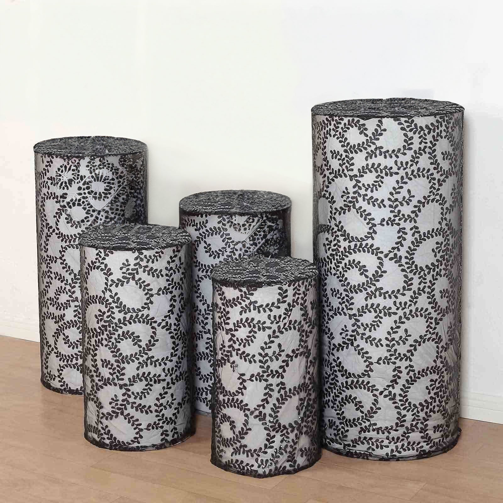Black sequin mesh cylinder pedestal stand covers with leaf vine embroidery.