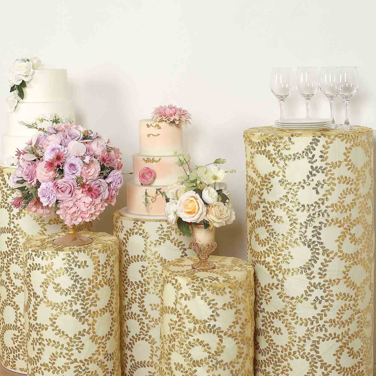 Gold sequin mesh cylinder pedestal stand covers with leaf vine embroidery.