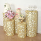 Gold sequin mesh pedestal stand covers with leaf vine embroidery.