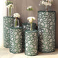 Emerald green sequin mesh pedestal stand covers with leaf vine embroidery.