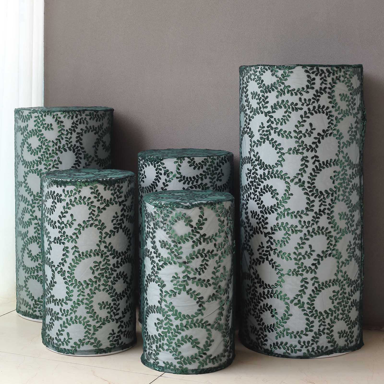 Emerald green sequin mesh pedestal stand covers with leaf vine embroidery.