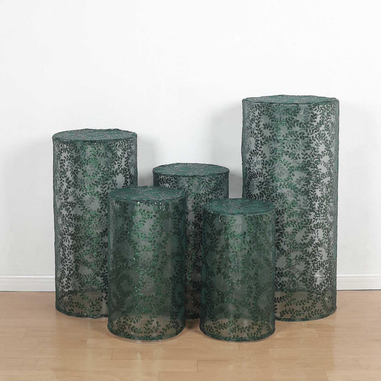 Emerald green sequin mesh pedestal stand covers with leaf vine embroidery.