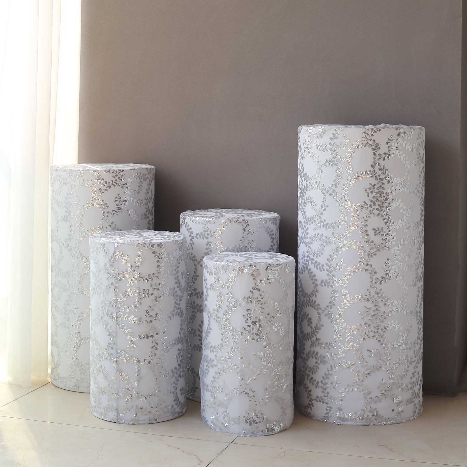 Silver sequin mesh cylinder pedestal stand covers with leaf vine embroidery.