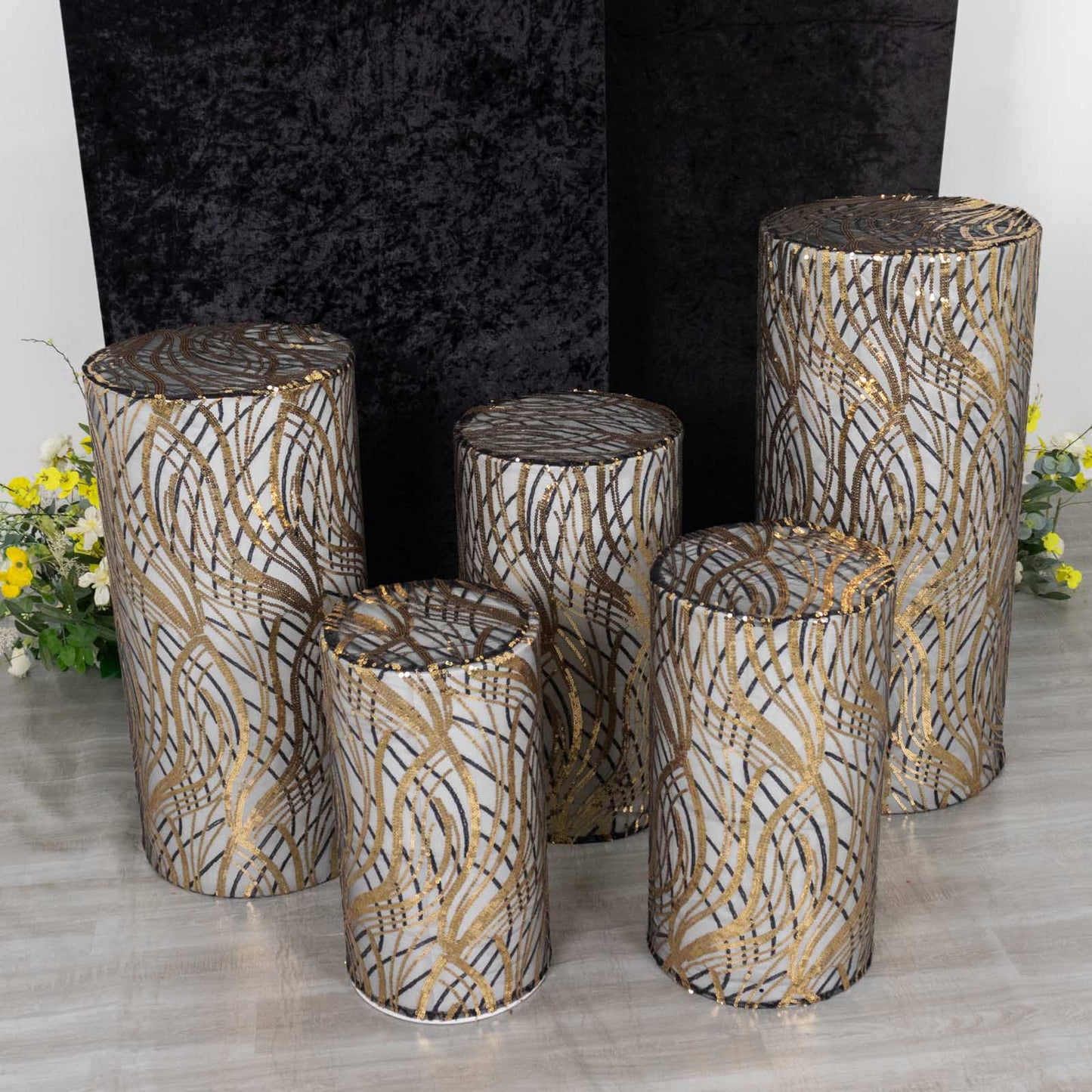 Set of 5 black wave mesh pedestal stand covers with sequins.