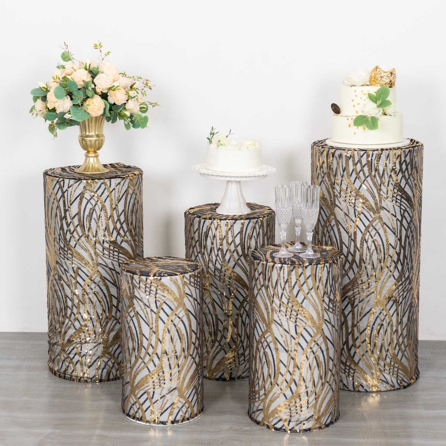 Set of 5 black wave mesh pedestal stand covers with sequins.