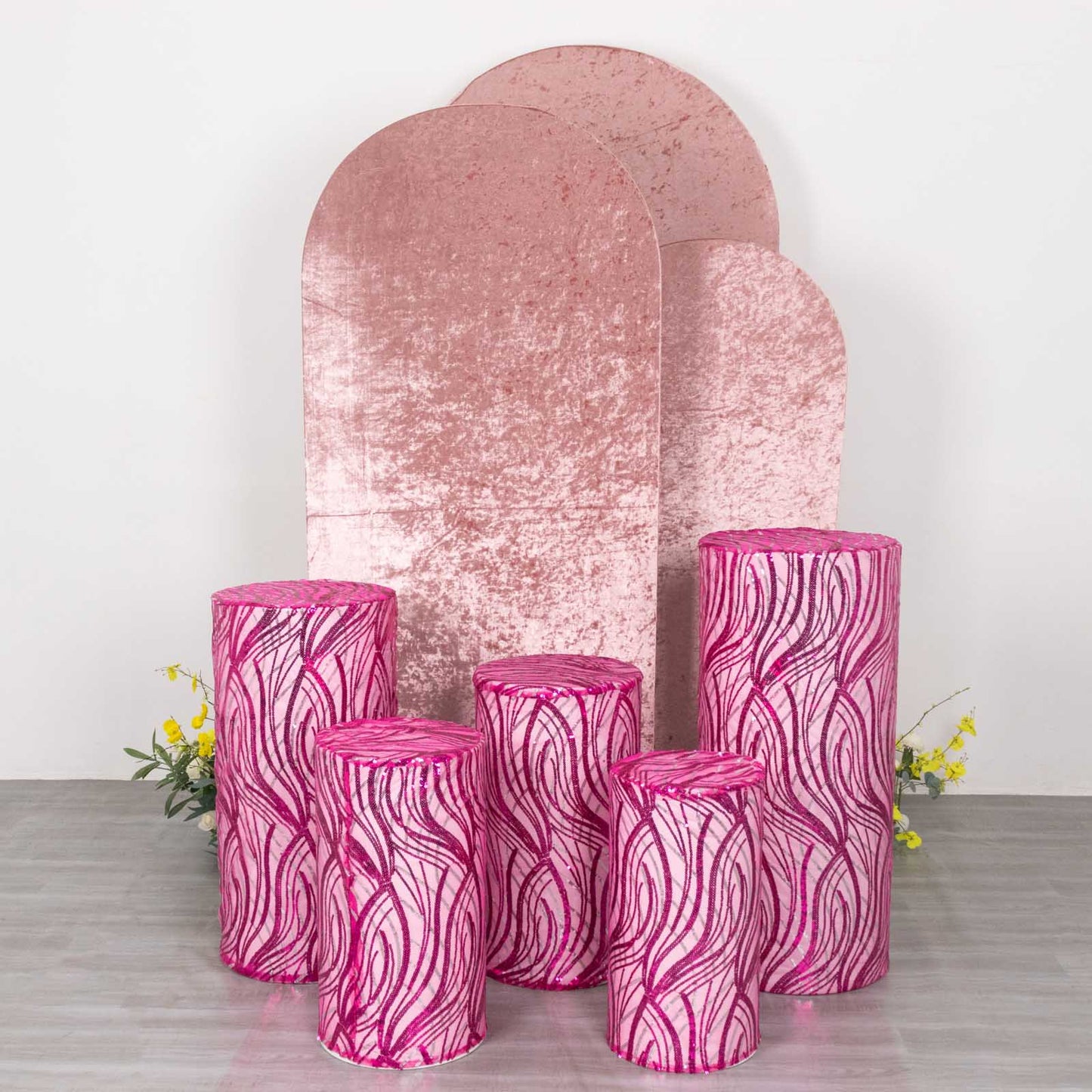 Fuchsia wave mesh cylinder pedestal stand covers with embroidered sequins.