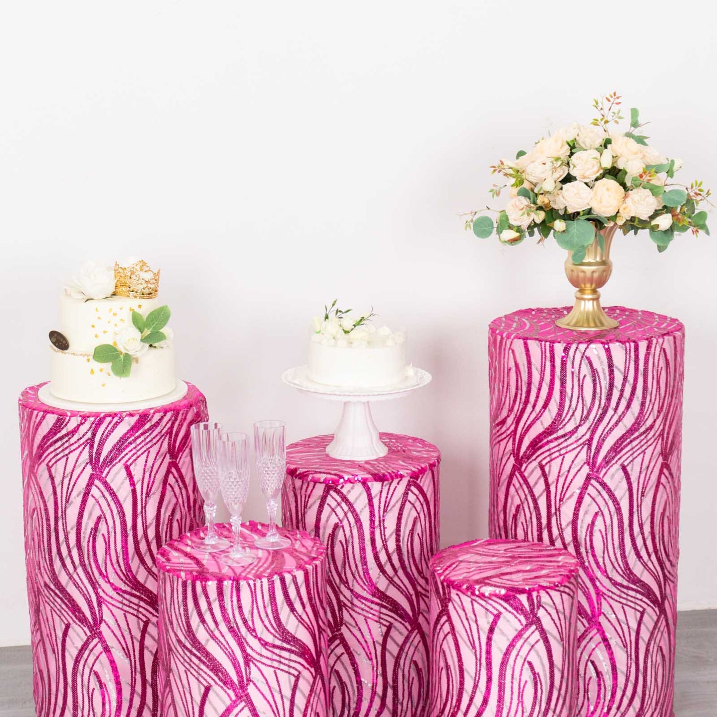 Fuchsia wave mesh pedestal stand covers with embroidered sequins.