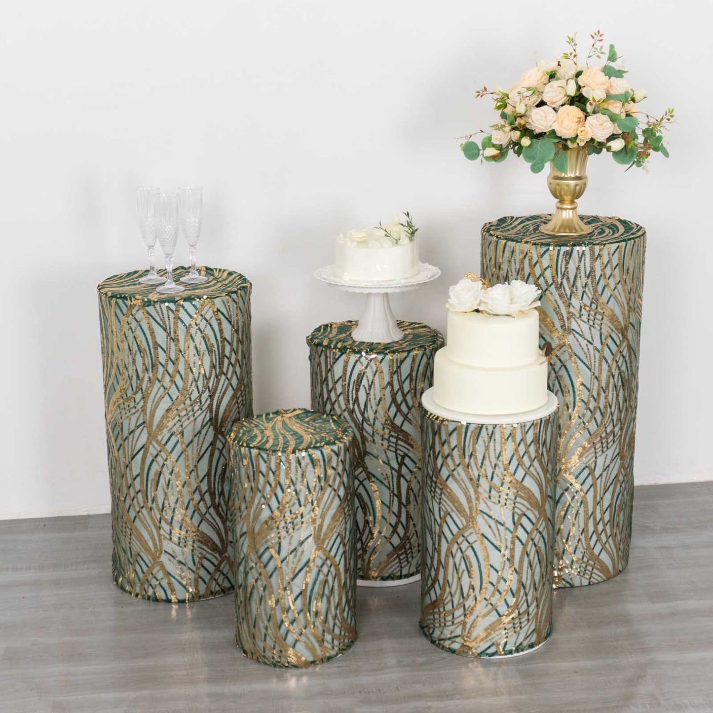 Set of 5 hunter green wave mesh pedestal stand covers with sequins.
