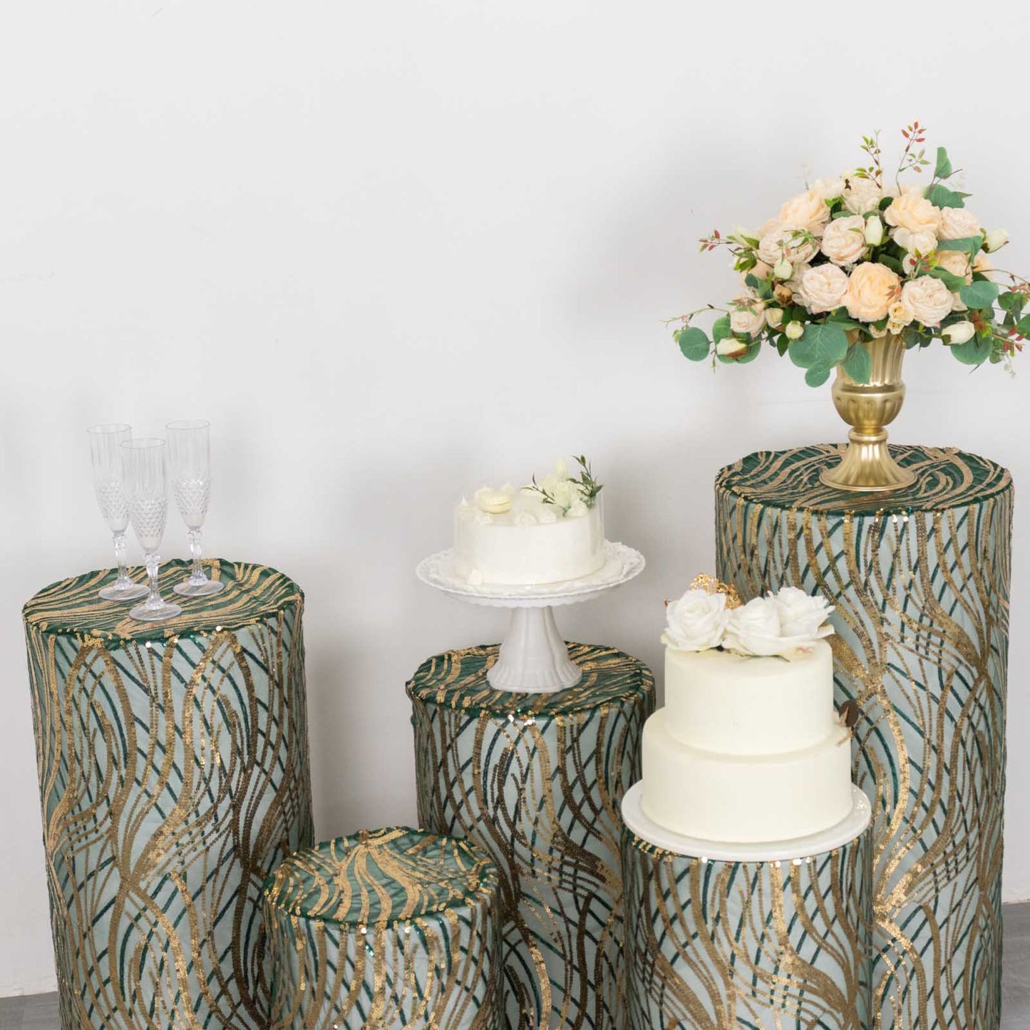 Hunter green wave mesh pedestal stand covers with embroidered sequins.