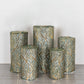 Set of 5 hunter green wave mesh pedestal stand covers with sequins.