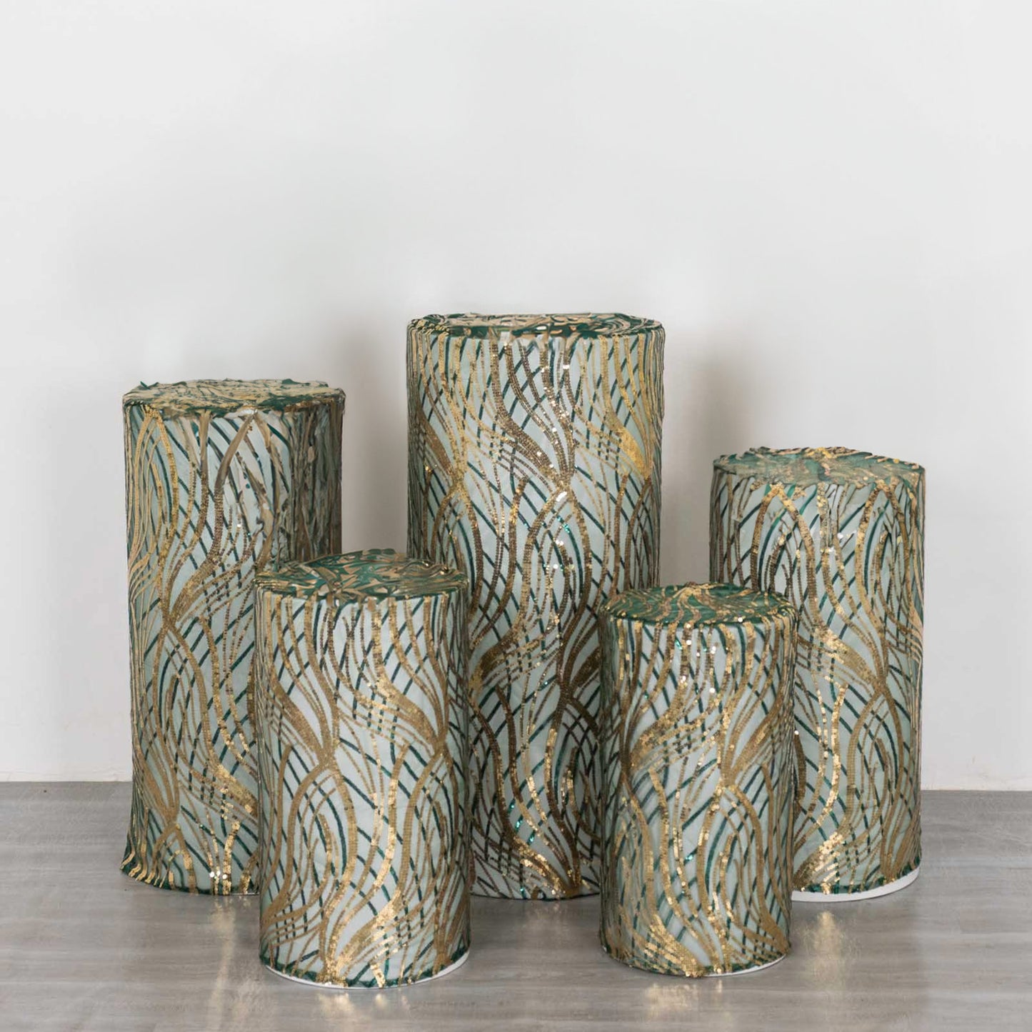 Set of 5 hunter green wave mesh pedestal stand covers with sequins.