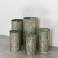 Hunter green wave mesh cylinder pedestal stand covers with embroidered sequins.