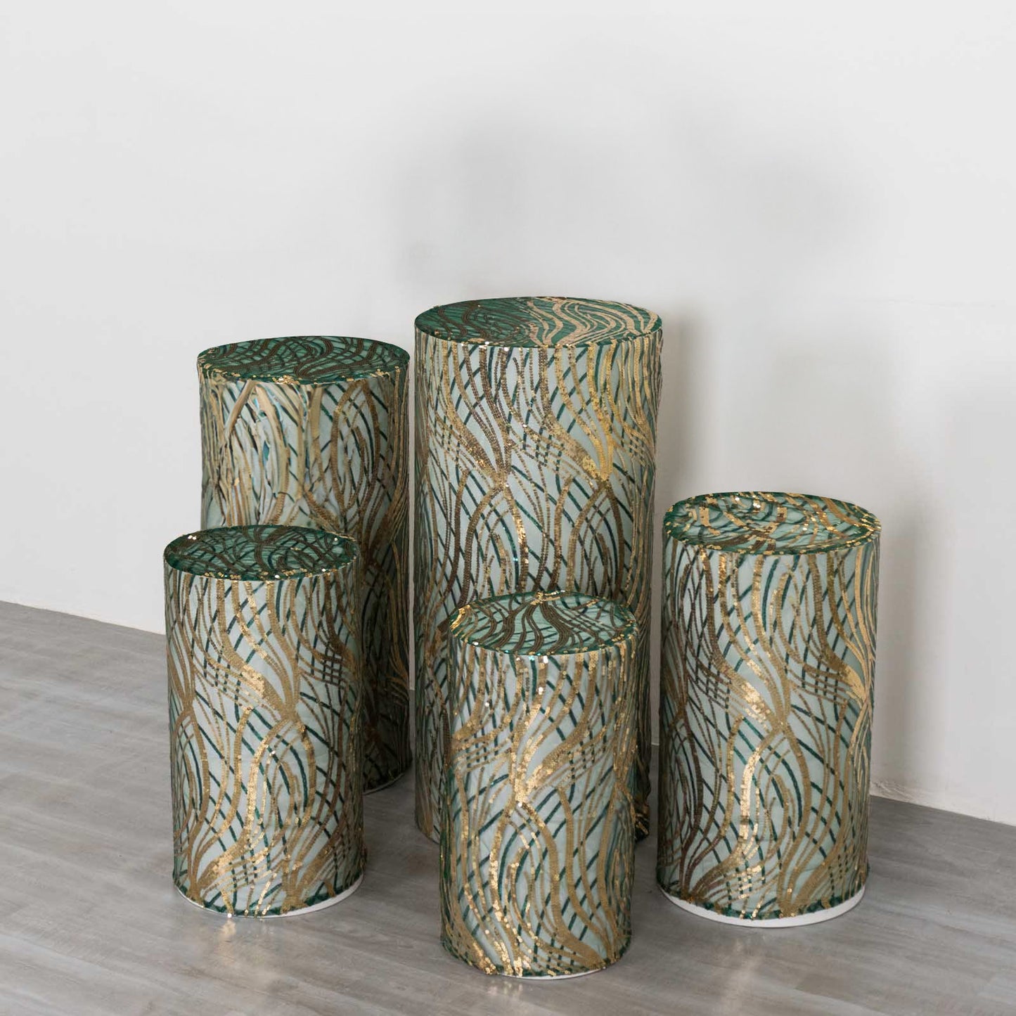 Hunter green wave mesh cylinder pedestal stand covers with embroidered sequins.