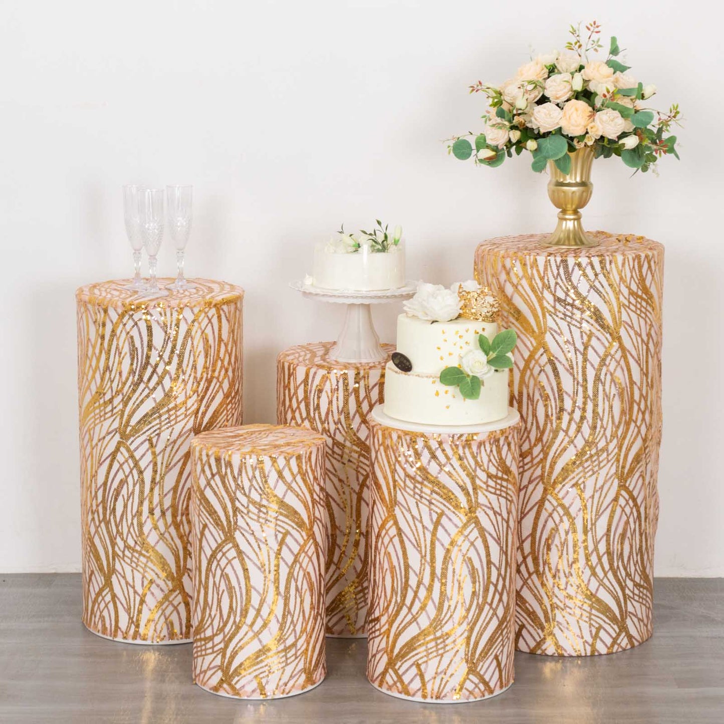 Rose gold wave mesh cylinder pedestal stand covers with embroidered sequins.