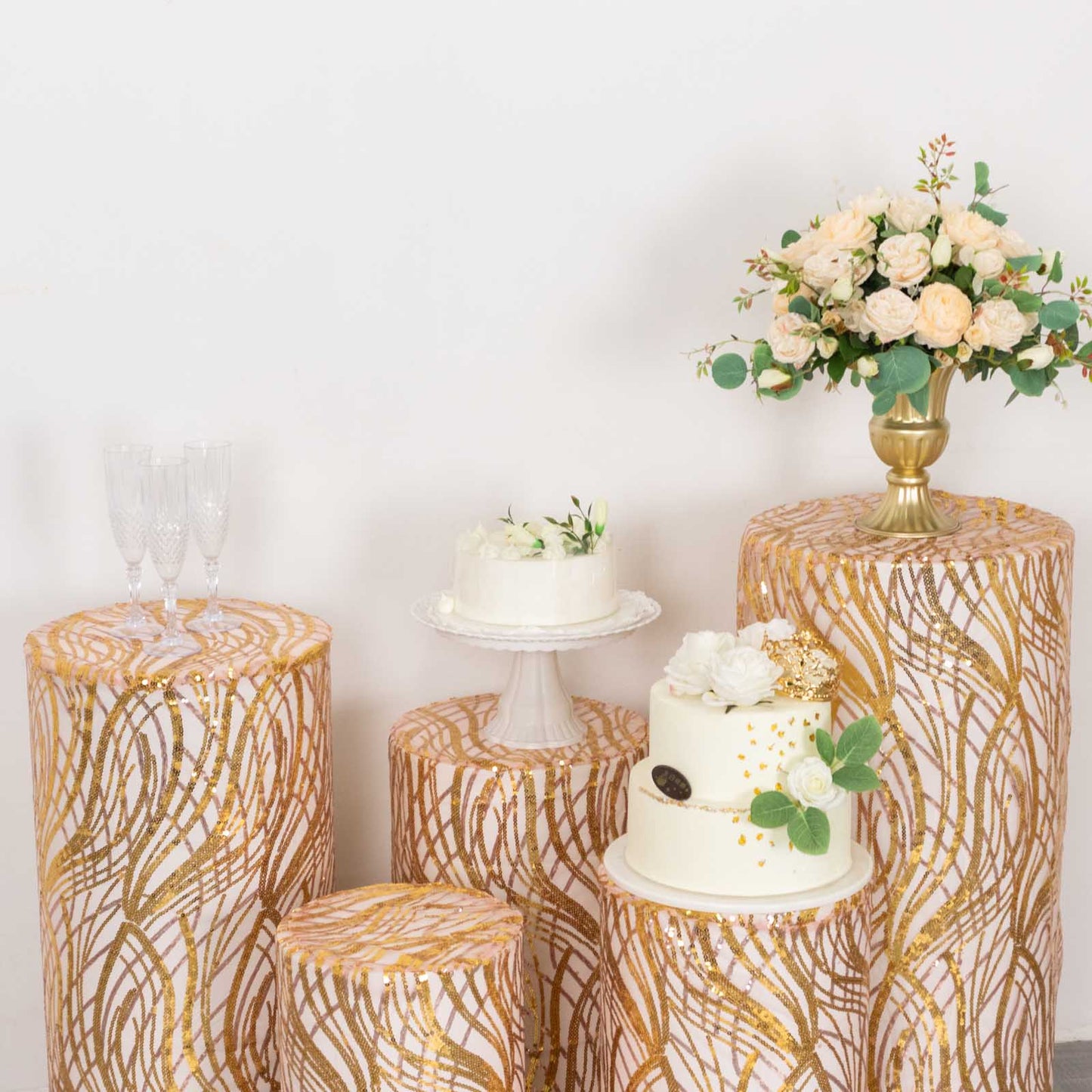 Gold wave mesh pedestal stand covers with embroidered sequins.