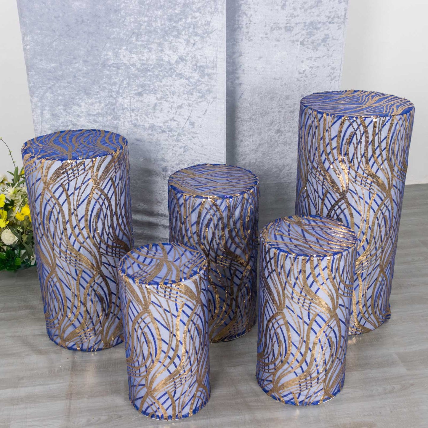 Royal blue wave mesh pedestal stand covers with embroidered sequins.